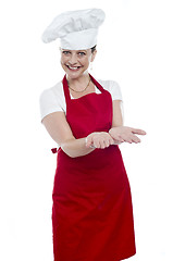 Image showing Female chef with open palms