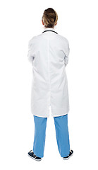 Image showing Back view of a female doctor. Full length shot