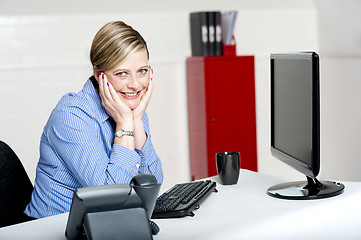 Image showing Corporate woman posing with both hands on her chick