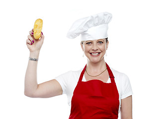 Image showing Female chef showing bread before baking it