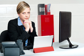 Image showing Serious business lady looking right into camera