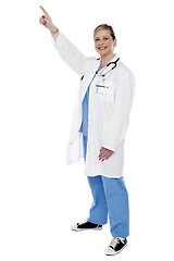 Image showing Medical expert pointing finger upwards