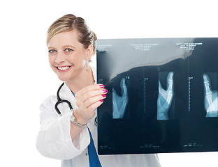 Image showing Female surgeon holding x-ray report