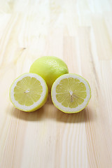Image showing fresh lemon  over pinewood table