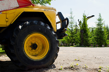 Image showing freight car wheel closeup. Agricultural machinery 