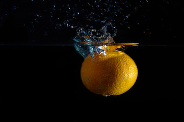 Image showing Orange and splash water