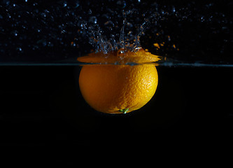 Image showing Orange and splash water