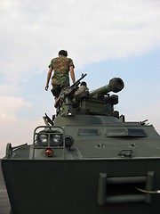 Image showing Military - soldiers on tank with machine gun