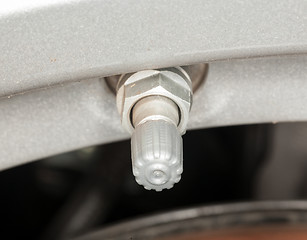 Image showing Silver tire pressure valve alloy wheel