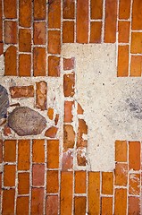 Image showing Fragment of ancient red brick wall with stones ant cement in it. 