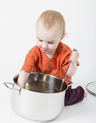 Image showing baby with big cooking pot