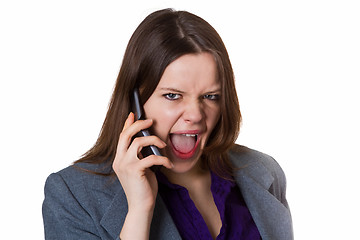 Image showing Businesswoman screaming into the phone