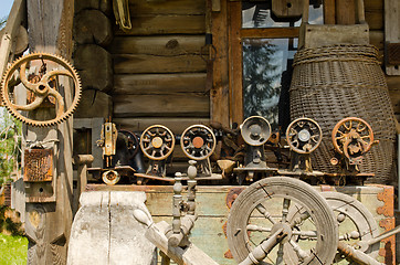 Image showing Old sewing and weaving machines tools log house 