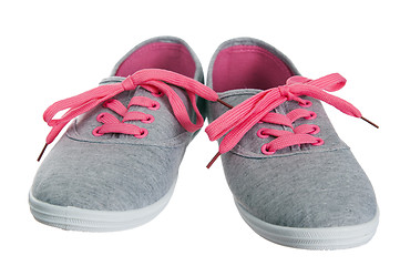 Image showing Beautiful female pink sneakers, it is isolated on white