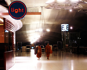 Image showing Monks walking into the light - EDITORIAL