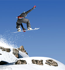 Image showing Snowboarder jumping