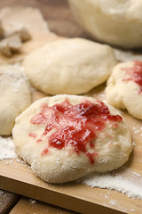 Image showing Sweet doughnuts with rose marmelade