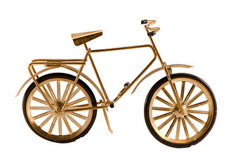 Image showing Small gold color toy bicycle isolated on white 