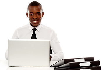 Image showing African corporate male manager at work desk