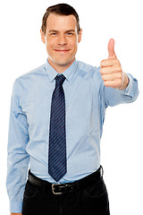 Image showing Smiling young man with thumbs up gesture