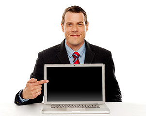 Image showing Businessman pointing at blank laptop screen