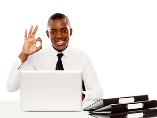 Image showing Smiling african male showing excellent symbol