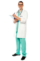 Image showing Full length portrait of doctor writing prescription