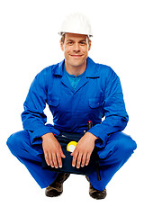 Image showing Smiling male worker wearing safety hat