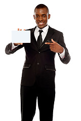 Image showing Business promoter pointing at blank placard