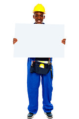 Image showing African contractor showing blank billboard