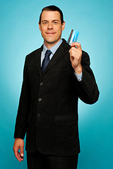 Image showing Male executive showing credit card