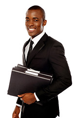 Image showing Handsome young executive holding files