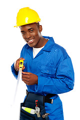 Image showing Portrait of african repairman with measuring tape