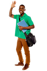 Image showing Cheerful student waving his hands. Enjoying himself