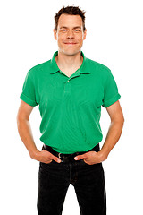 Image showing Smiling guy posing with hands in jeans pocket