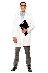 Image showing Full length shot of doctor posing with clipboard