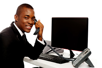 Image showing African businessman attending phone call