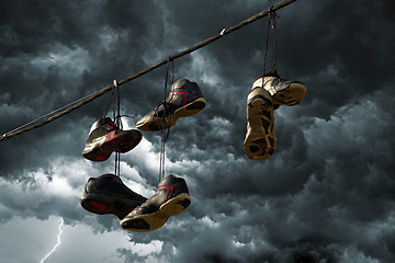 Image showing Sneakers Hanging on a Telephone Line