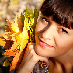 Image showing woman with autumn leaves