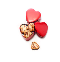 Image showing heart shaped cream cookies on red heart metal box