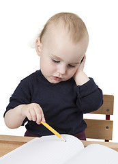 Image showing young child at writing desk