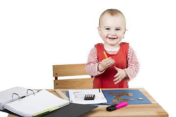 Image showing young child at writing desk