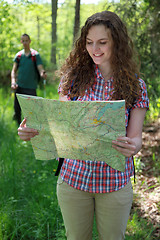 Image showing Hiker is reading a map