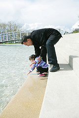 Image showing Father and daughter playing in the park at spring in Ouchy, Swit