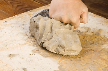 Image showing Child hands of a potter