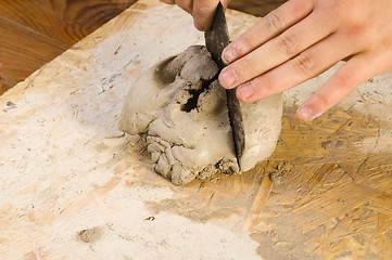 Image showing Child hands of a potter