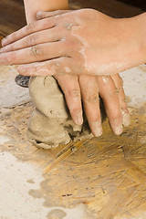 Image showing Child hands of a potter