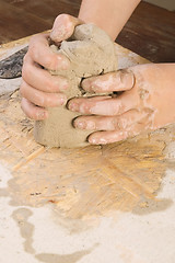 Image showing Child hands of a potter