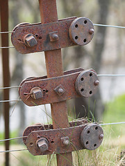 Image showing Rusty steel wire fence and tensioner, Scotland.