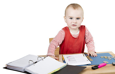 Image showing young child at writing desk